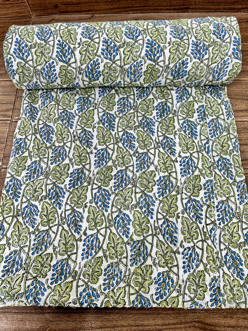 reversible Kantha-stitched block-printed Cotton Throw in white green leaf